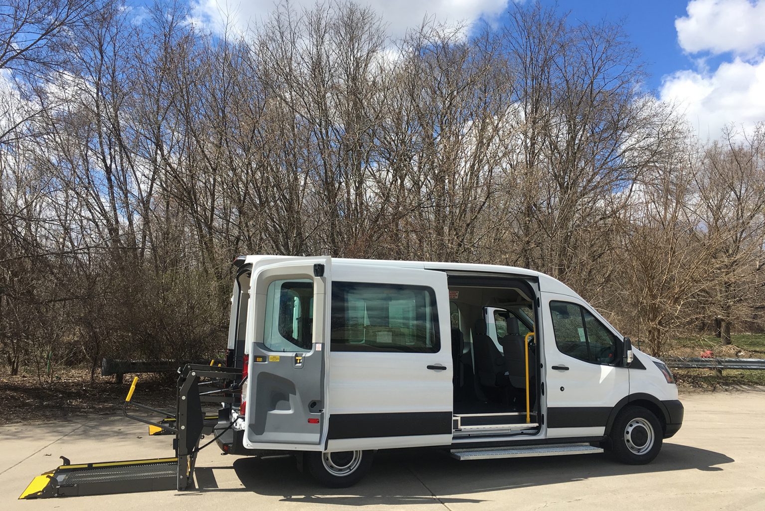 ADA Accessible Vans with their lift gates on the ground